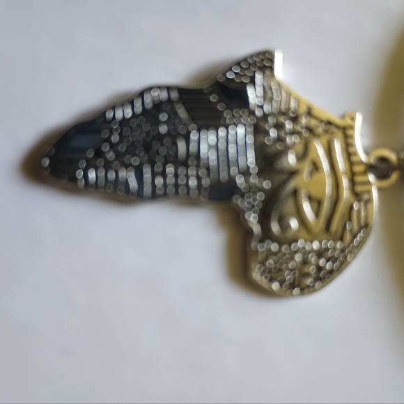 African Egyptian Eye of the Soul Emblem Necklace on a black cord.